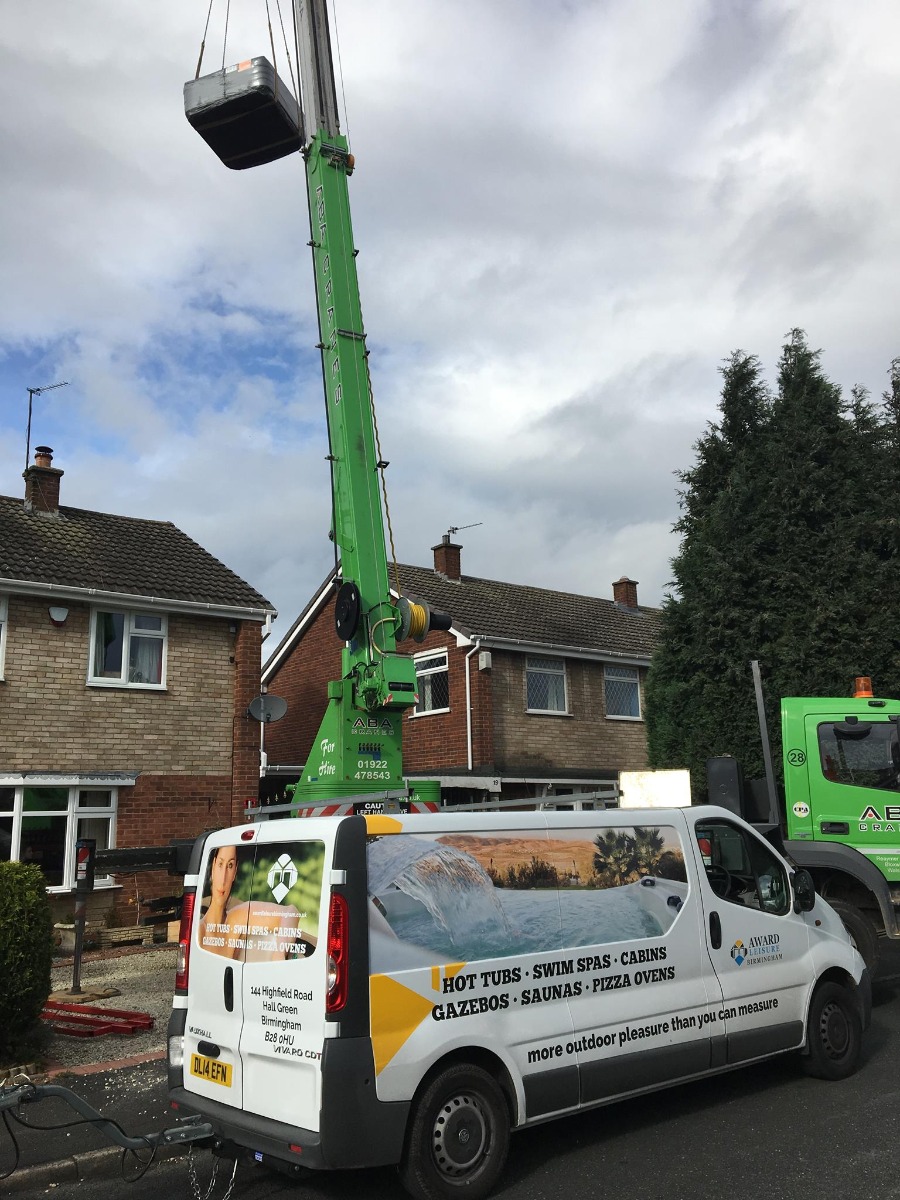 We can crane your Hot Tub over your house to get your spa into position