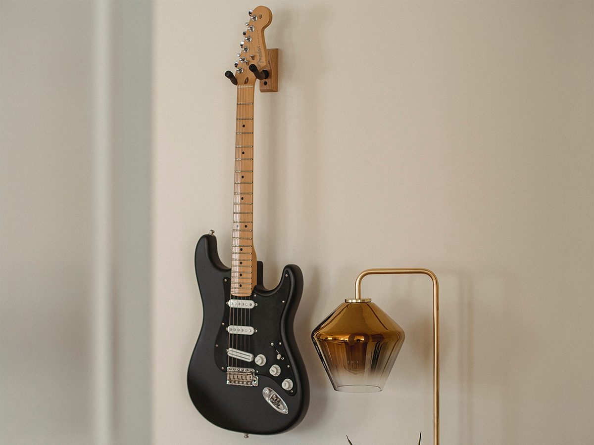 Guitar hanging on wall