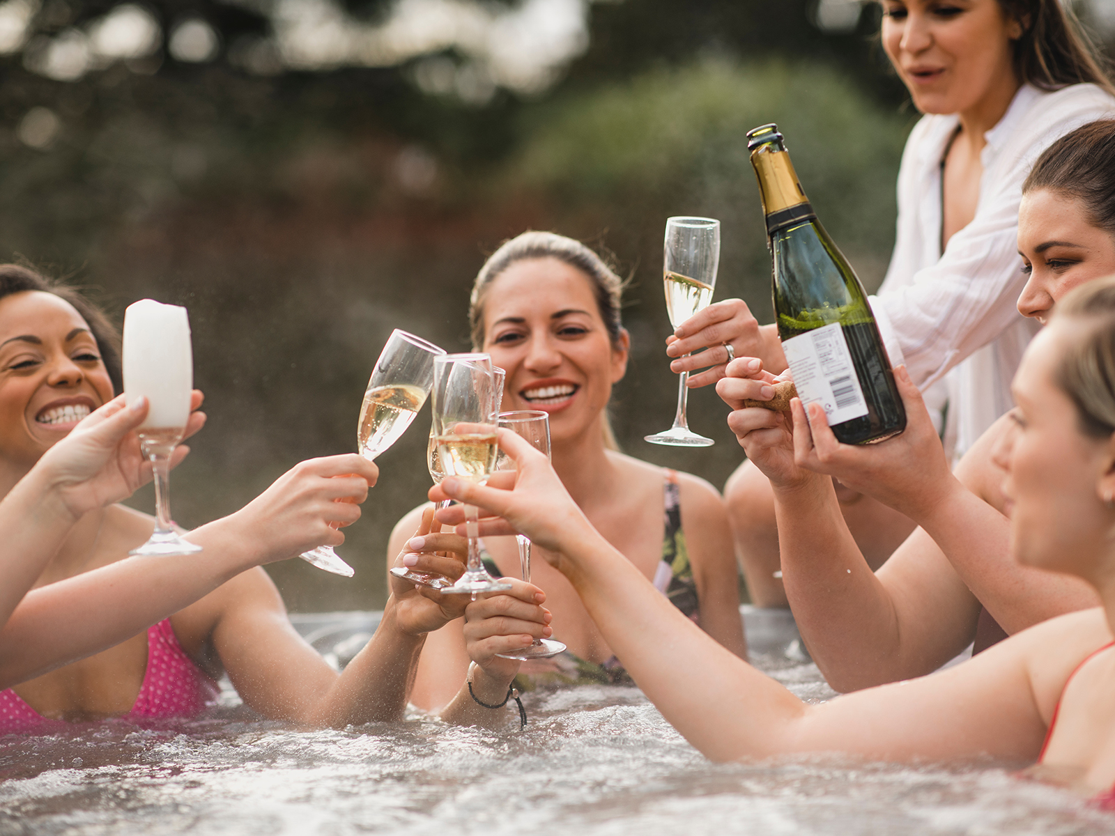 group of friends in a hot tub